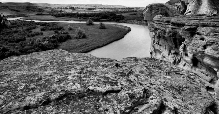 rocky cliff by river